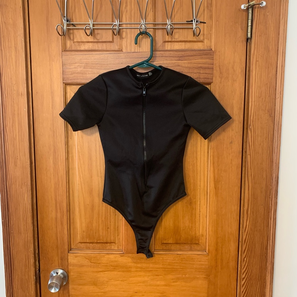 Women’s black zip up bodysuit